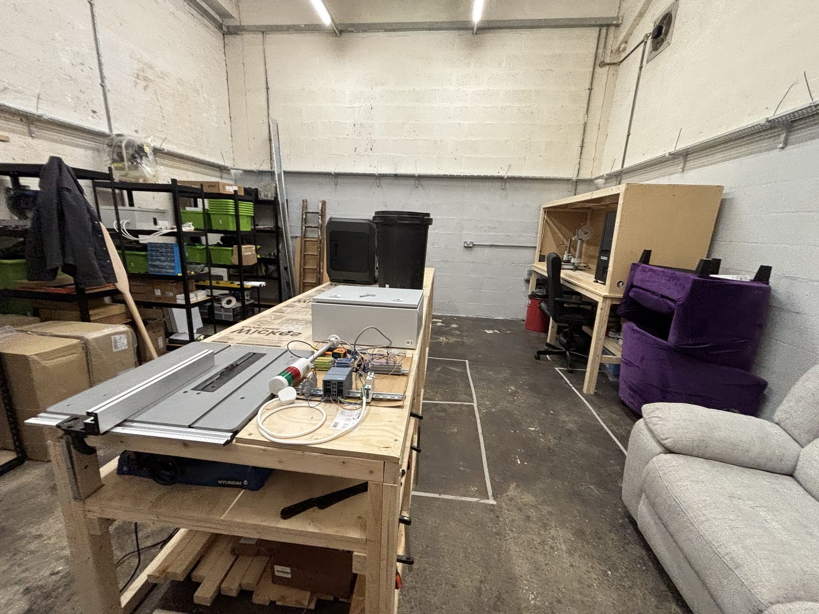 Workbenches, tools and storage inside the Carlisle makerspace workshop