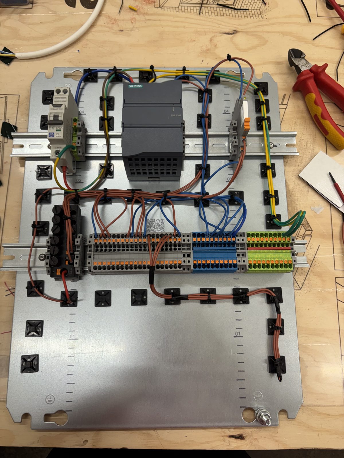An electronics control panel project being assembled